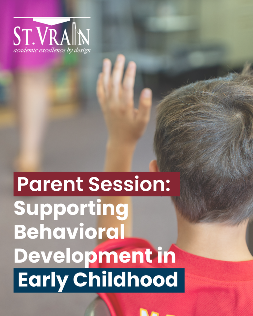 Child raising hand in a classroom during a parent session on behavioral development in early childhood.