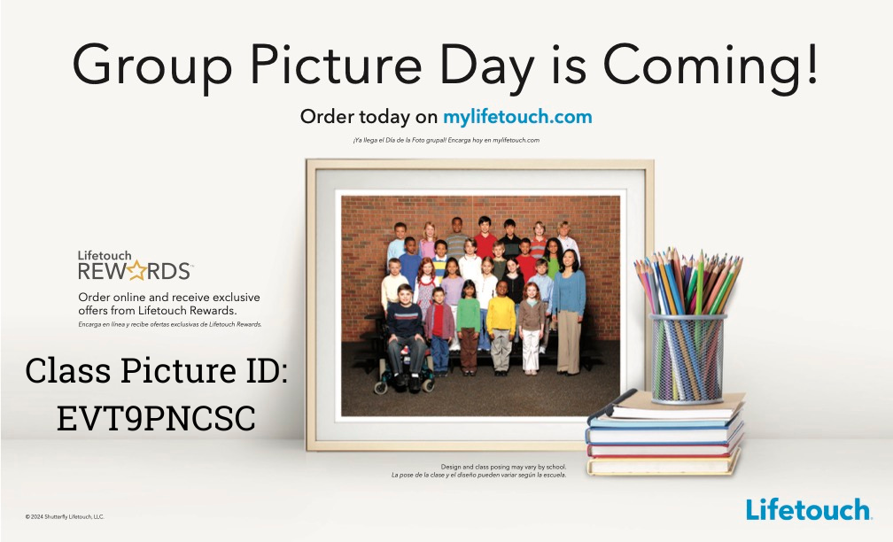 Announcement for Group Picture Day with a framed class photo and a pencil holder on a stack of books.
