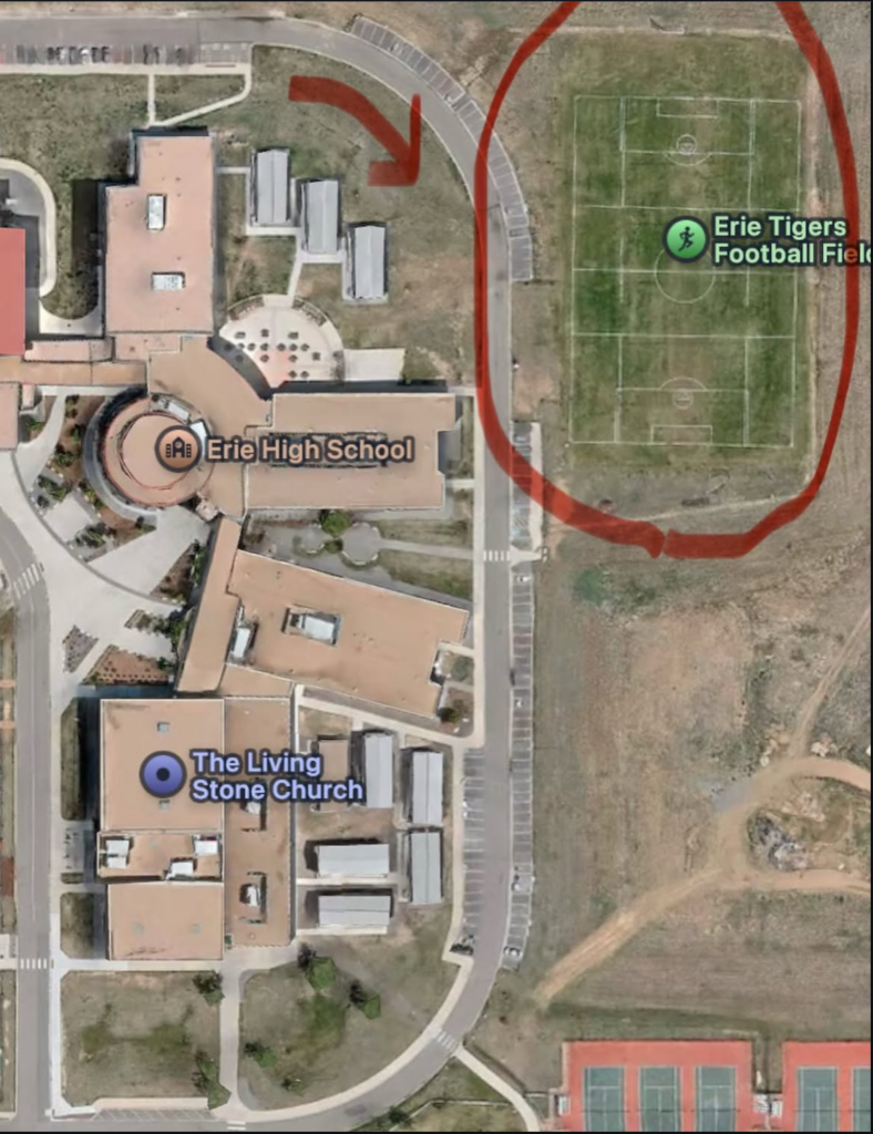 Aerial view of Erie High School, The Living Stone Church, and the Erie Tigers Football Field with surrounding pathways.